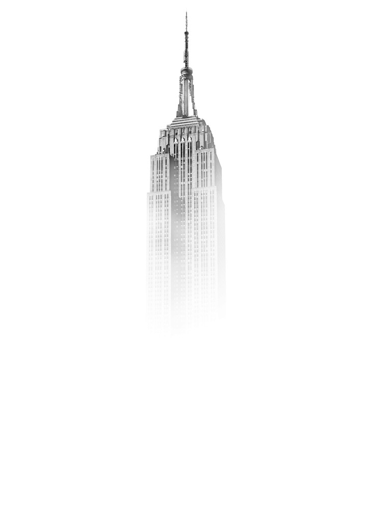 black white image showing the spear of the empire state building in a white fog.