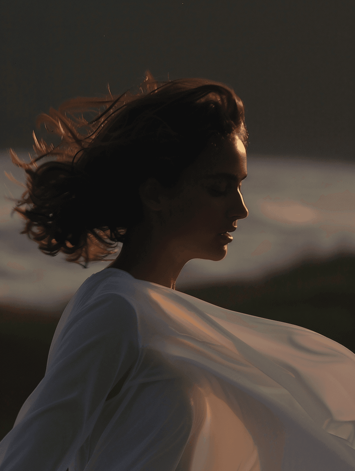 Person in white shirt with fabric catching the evening light
