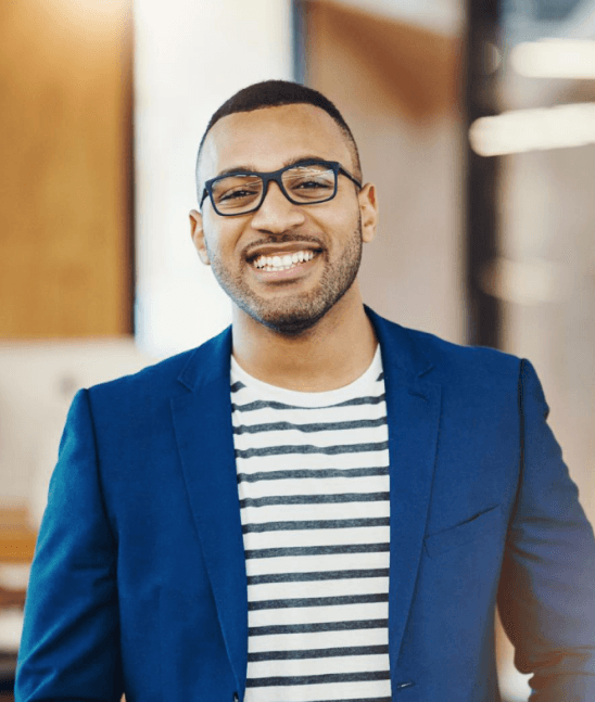 A man standing and smiling