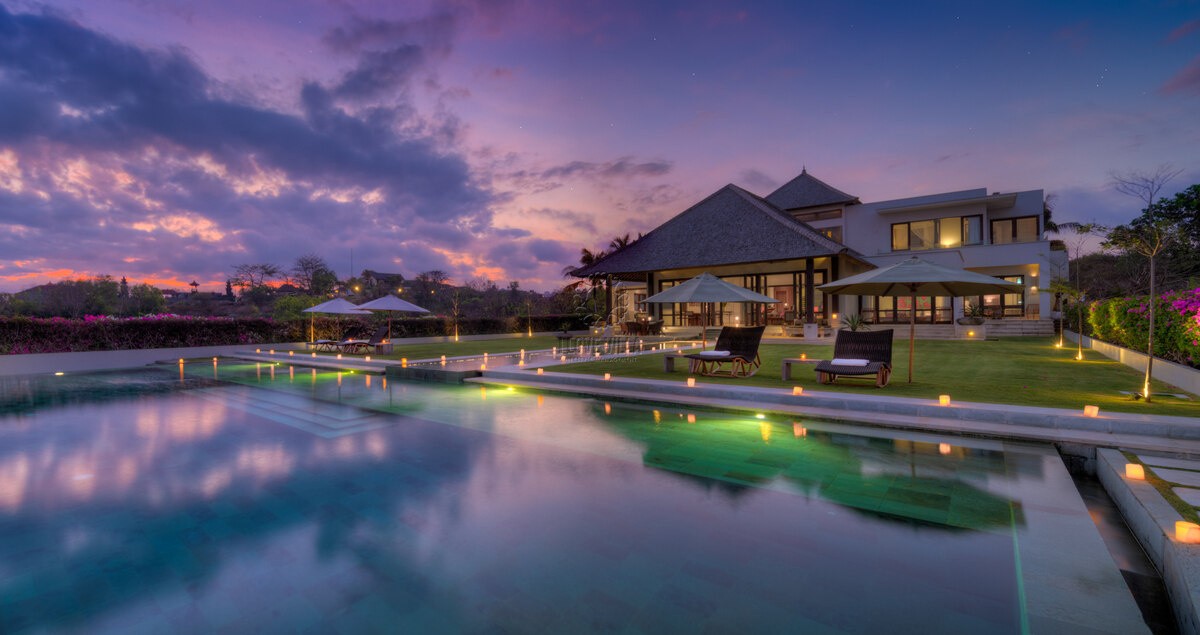 Aerial view of a luxury cliffside villa in Ungasan, Bali, managed by our professional real estate agents.