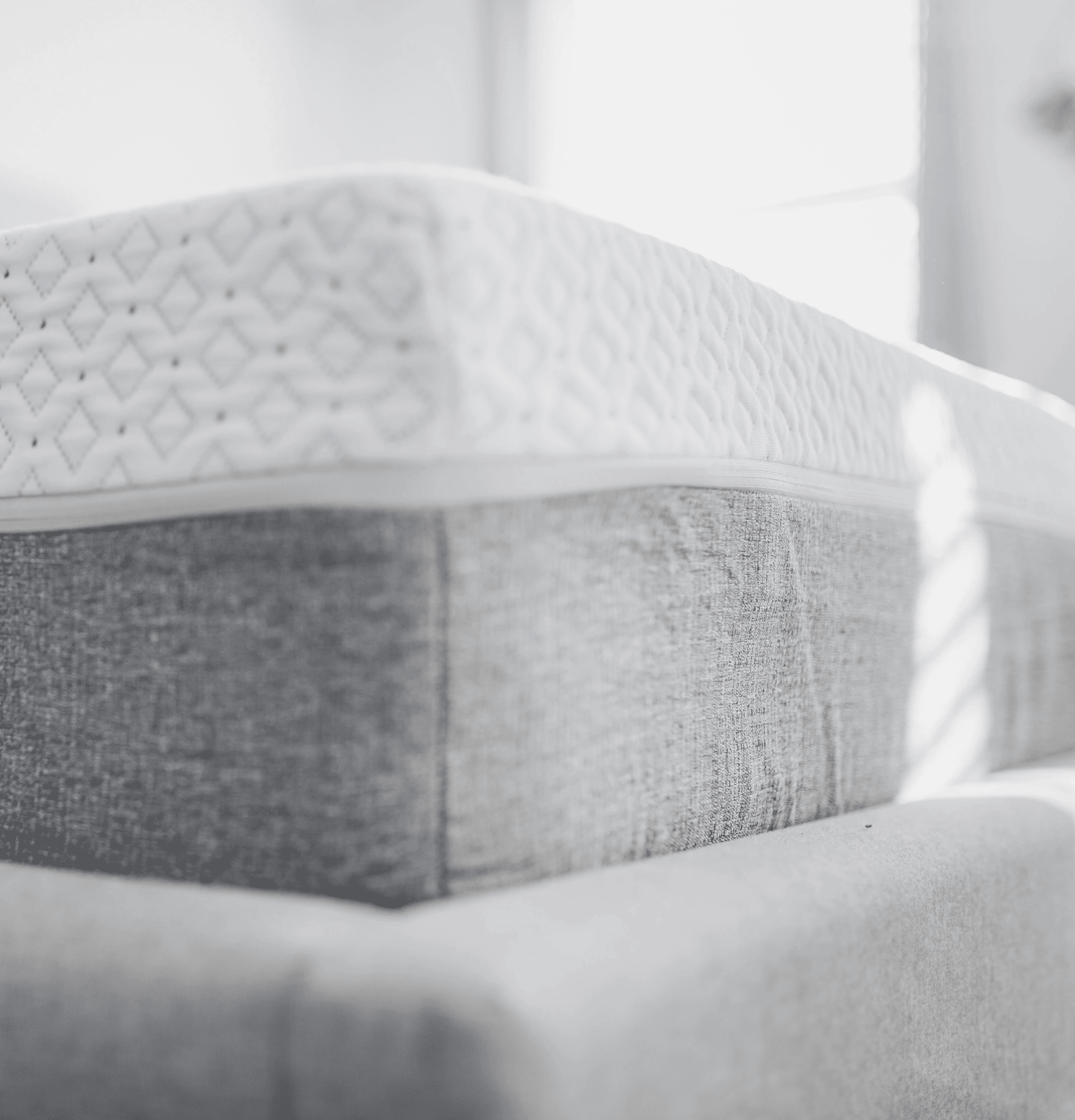 a close up of a mattress with a red label on it