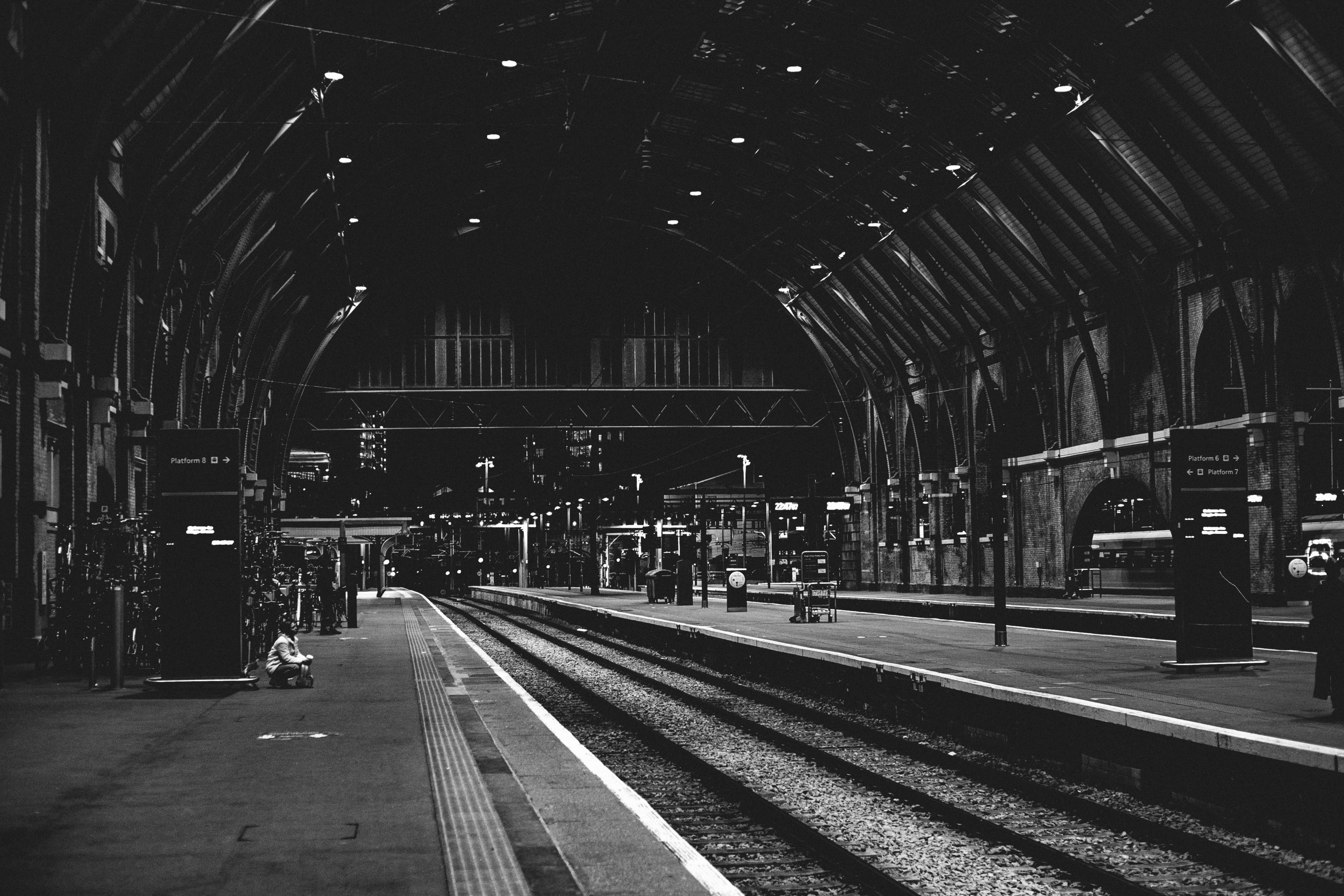 a black and white photo of a train station