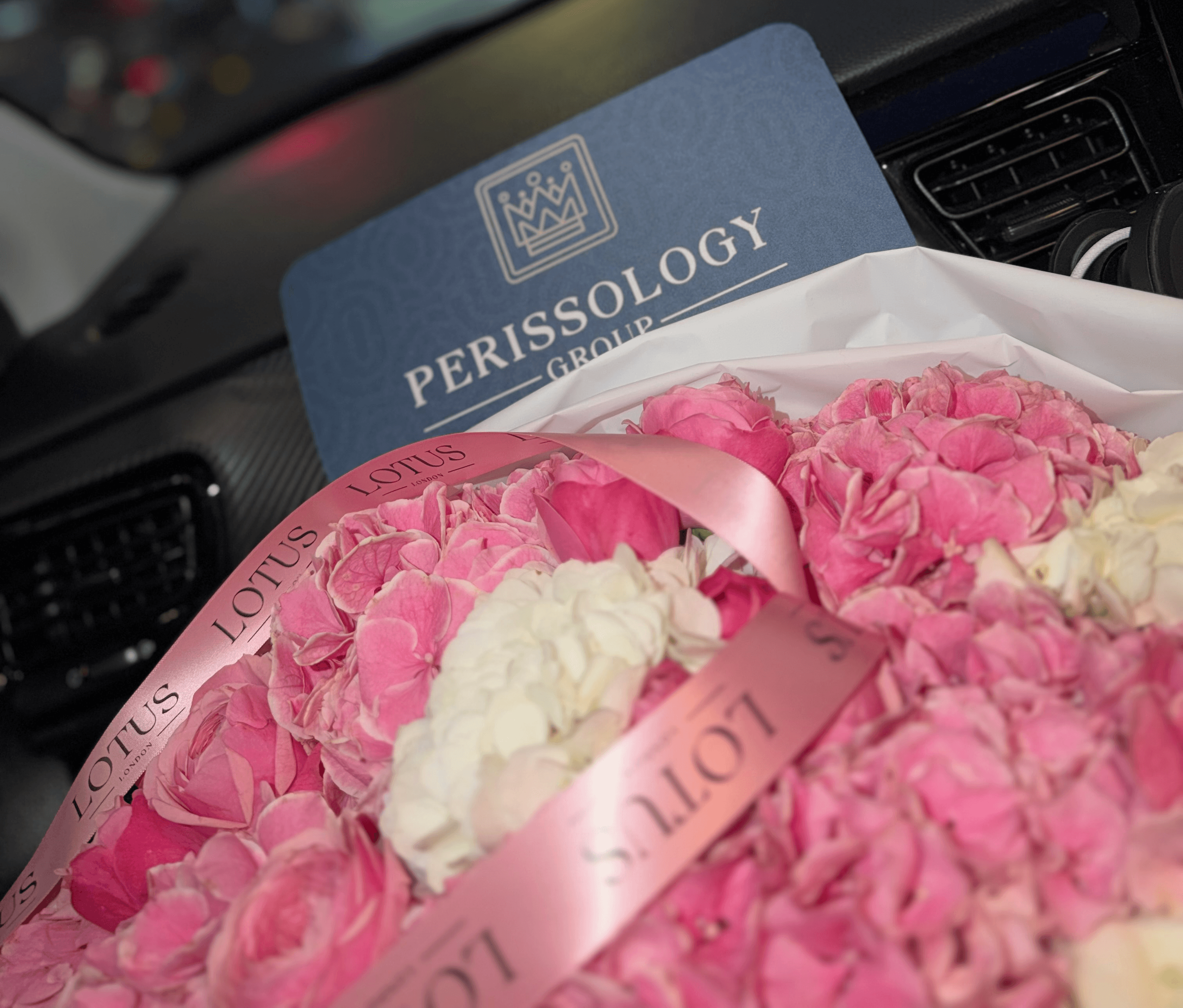 Perissology delivering a very large bunch of flowers