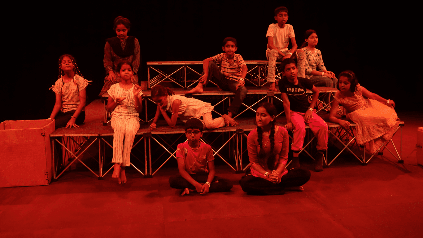 Image of children taking part in a play written by them