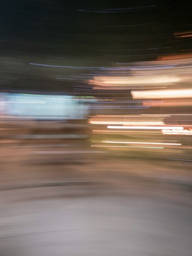 a blurry photo of a person riding a skateboard