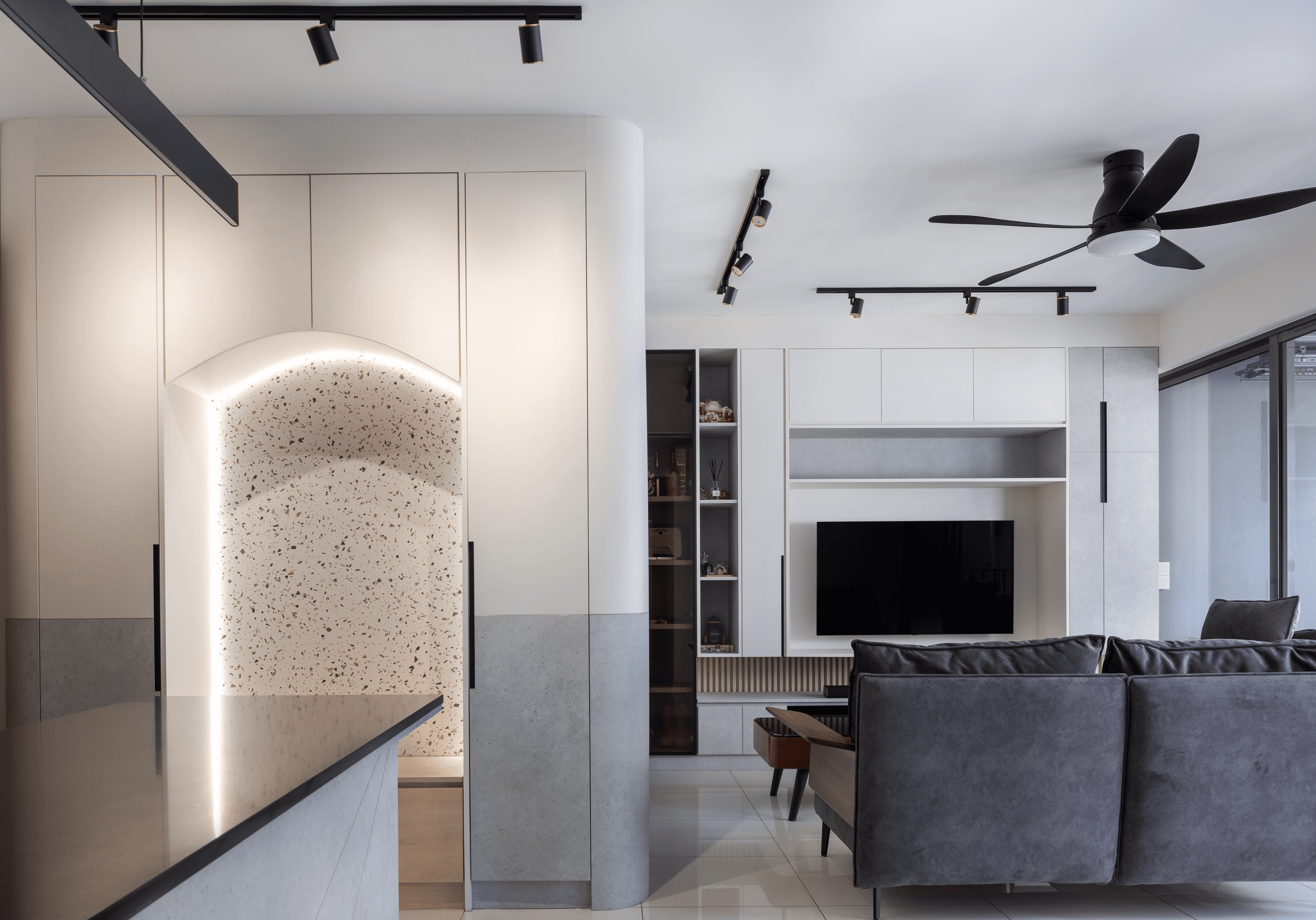 Living area with warm tones, wood paneling, and ambient lighting.