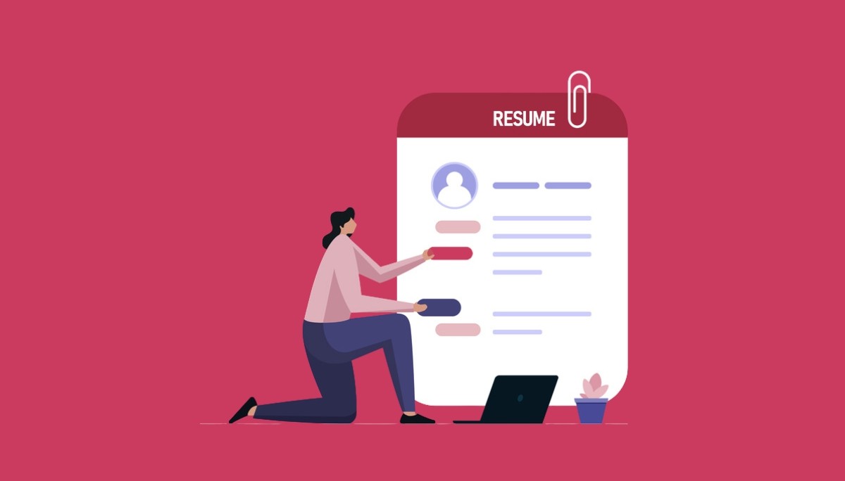 Illustration of a person kneeling beside a large resume document labeled “RESUME,” surrounded by a laptop and office items—symbolizing the structured, professional format of the Harvard resume template and how to use it effectively.