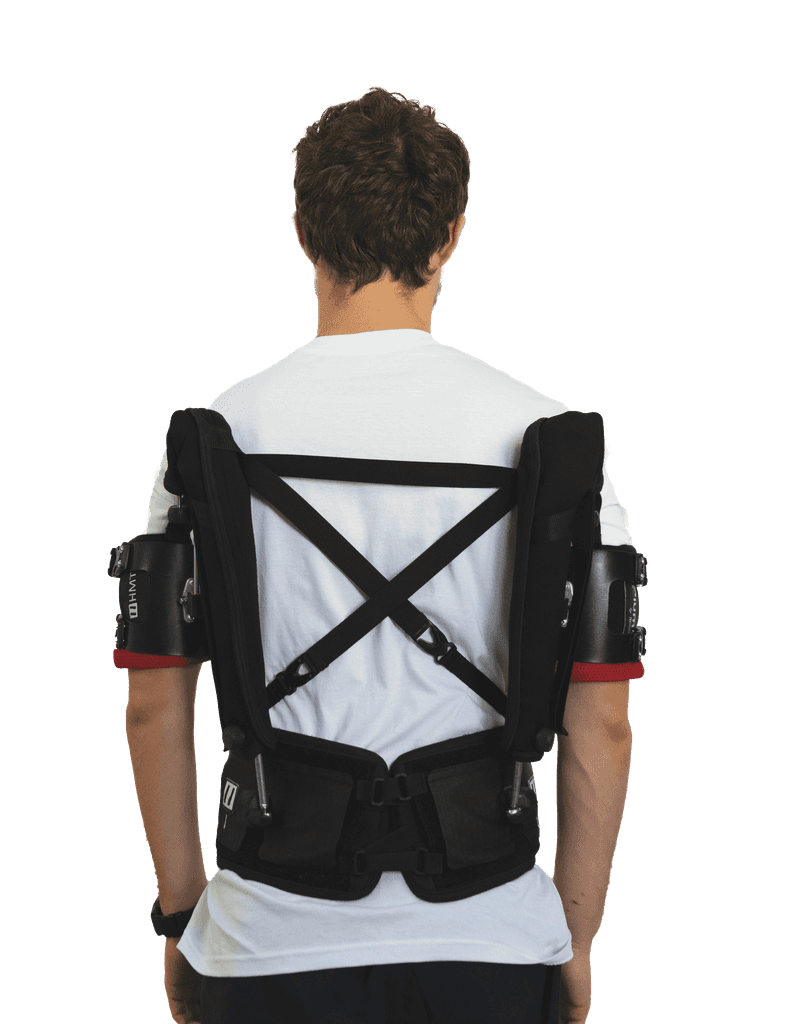 Rear view of a person wearing the Plum' exoskeleton, designed to provide support for the arms and shoulders during repetitive tasks at height.