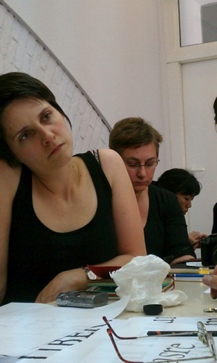 woman leaning her head to left and listening