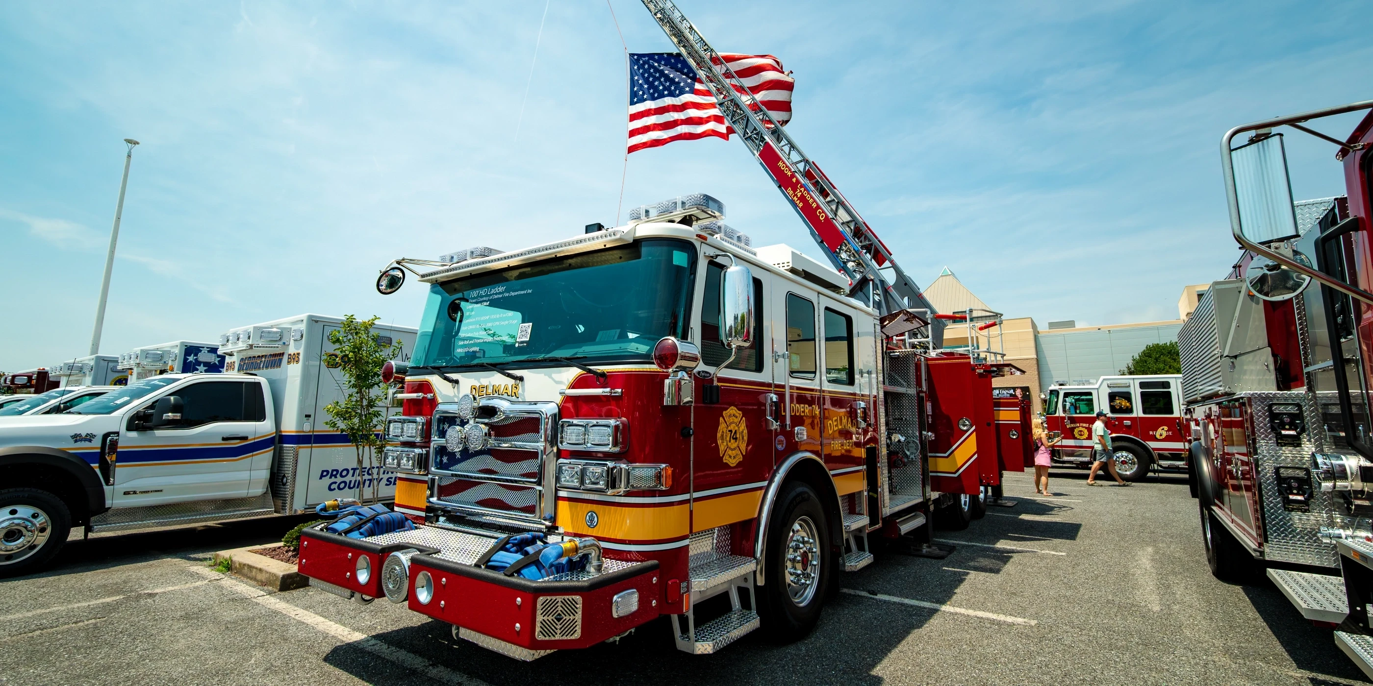 Firefighters beside apparatus
