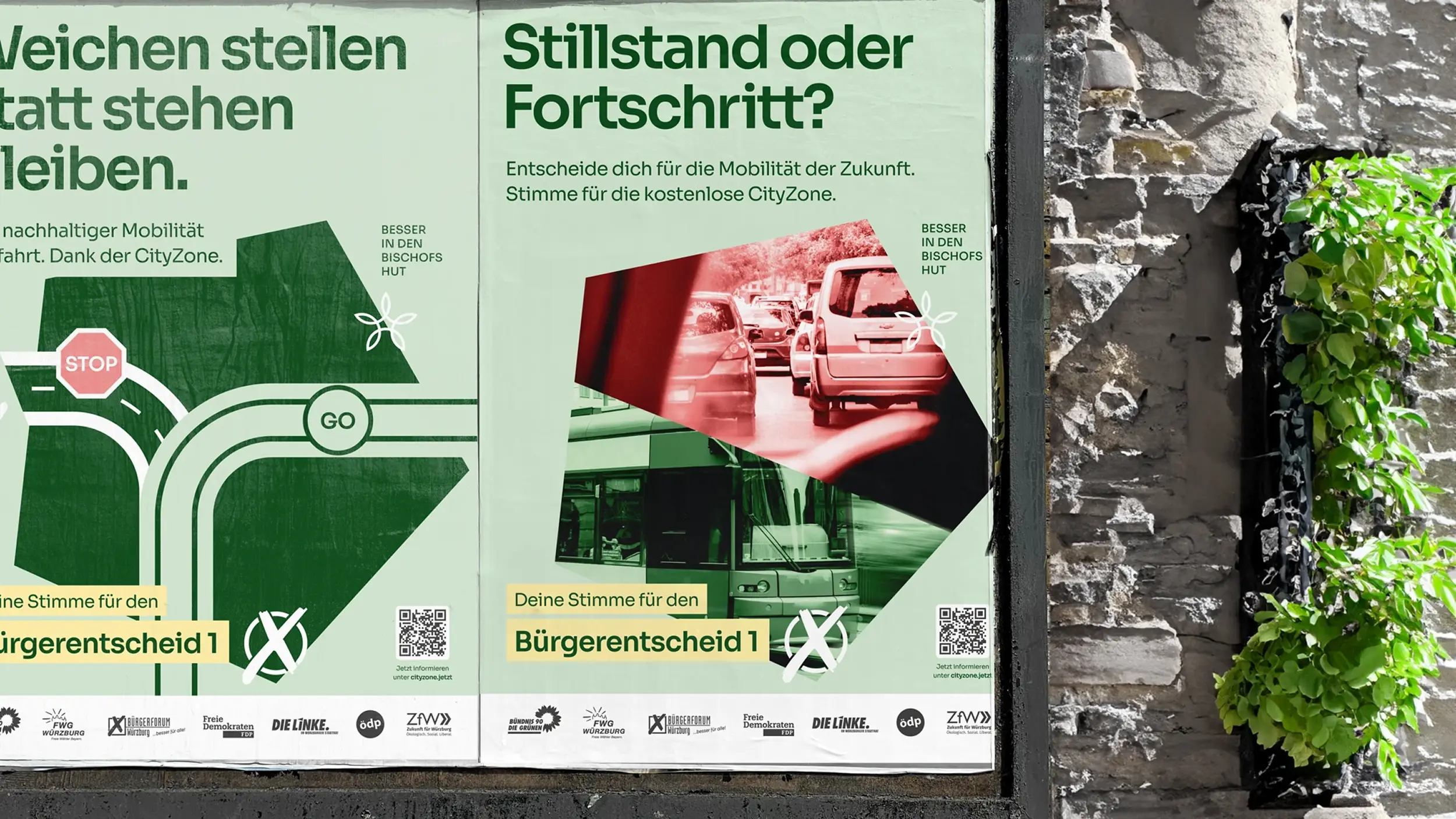 Zwei Plakate „Weichen stellen statt stehen bleiben“ und „Stillstand oder Fortschritt?“ an einer Steinwand.