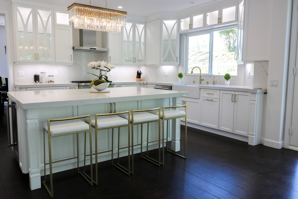 classic white shaker kitchen cabinetry with gold handles