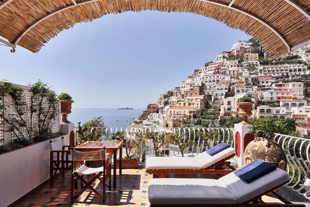 aerial view of buildings and flying birds