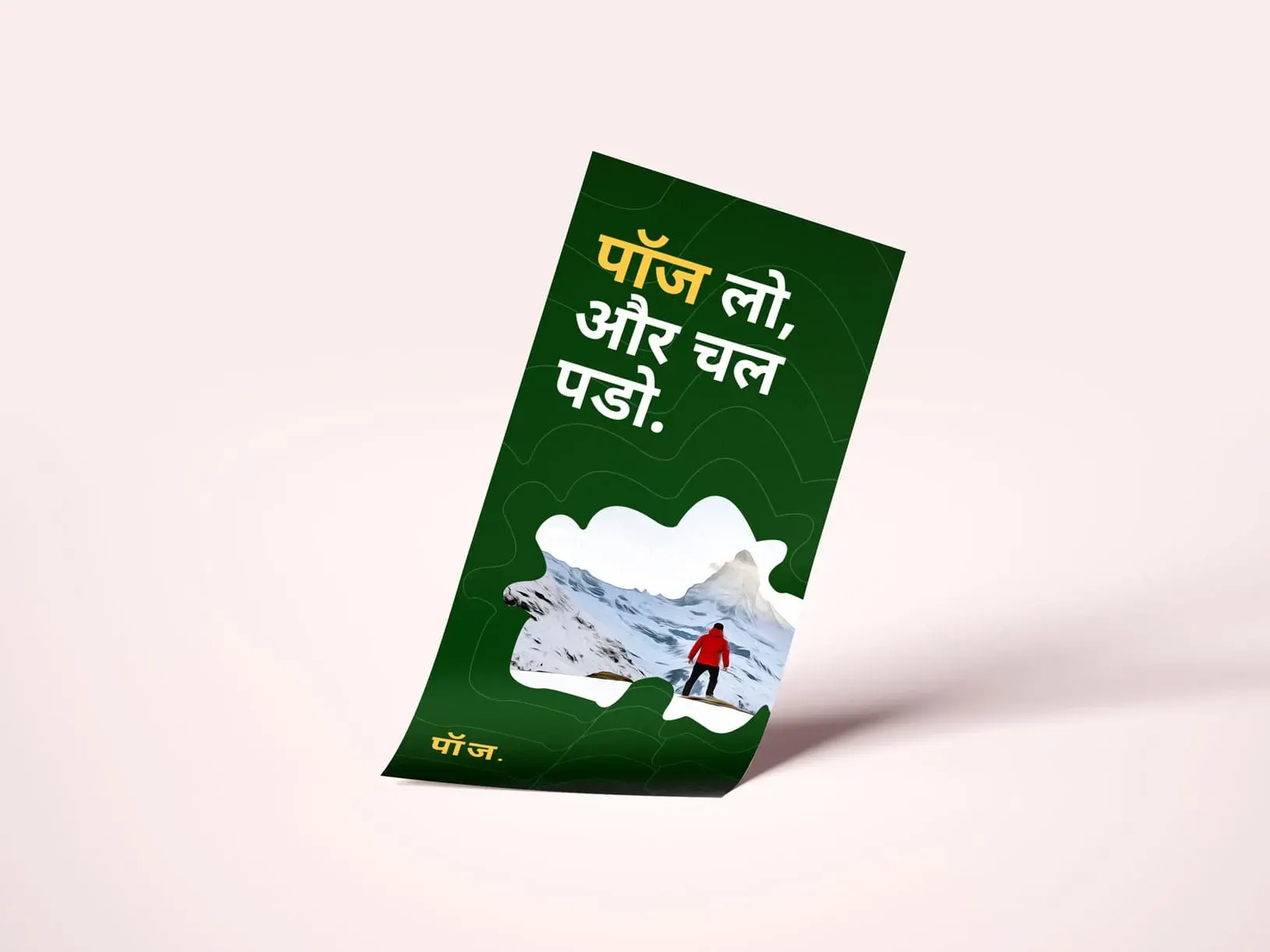Tilted green Hindi poster reading “पॉज़ लो और चल पड़ो,” with a hiker in red trekking across snowy mountains; inspiring outdoor adventure tone.