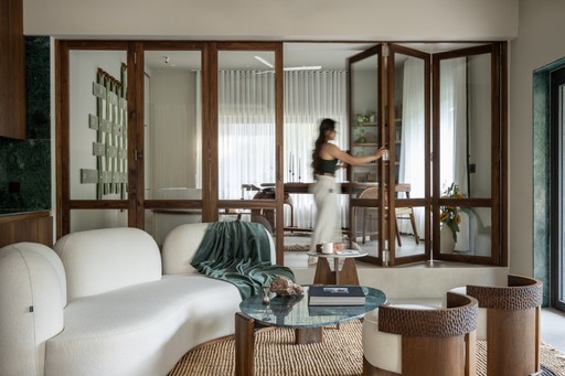 selective focus photography of woman and man using MacBook Pro on table