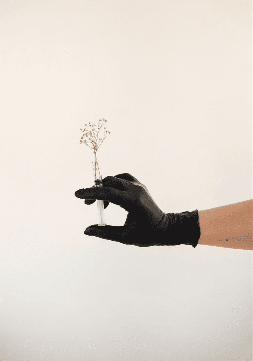 Two men talking, one wears a veteran hat.