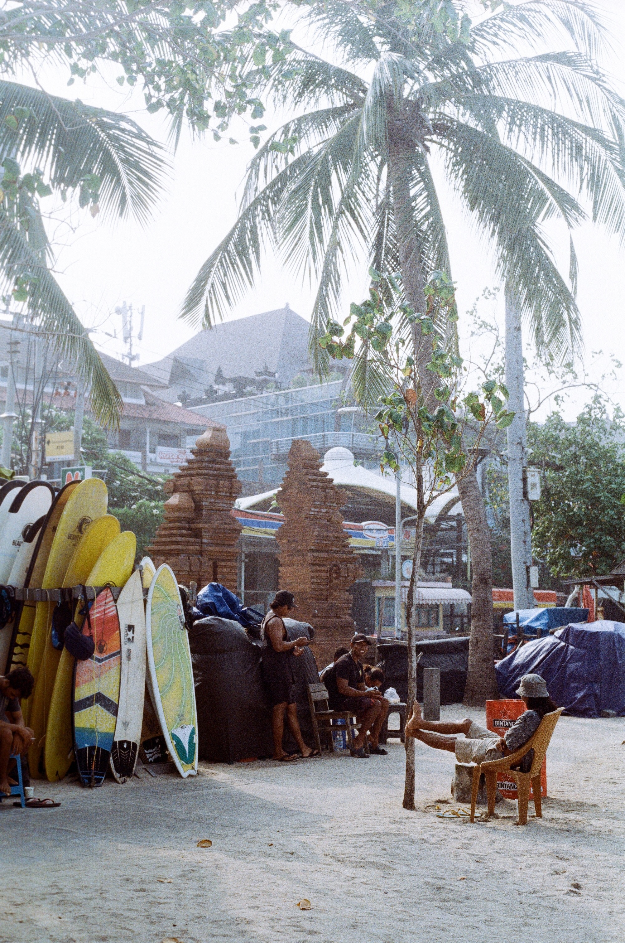 local surfers chilling at surf spot Kuta in Indonesia