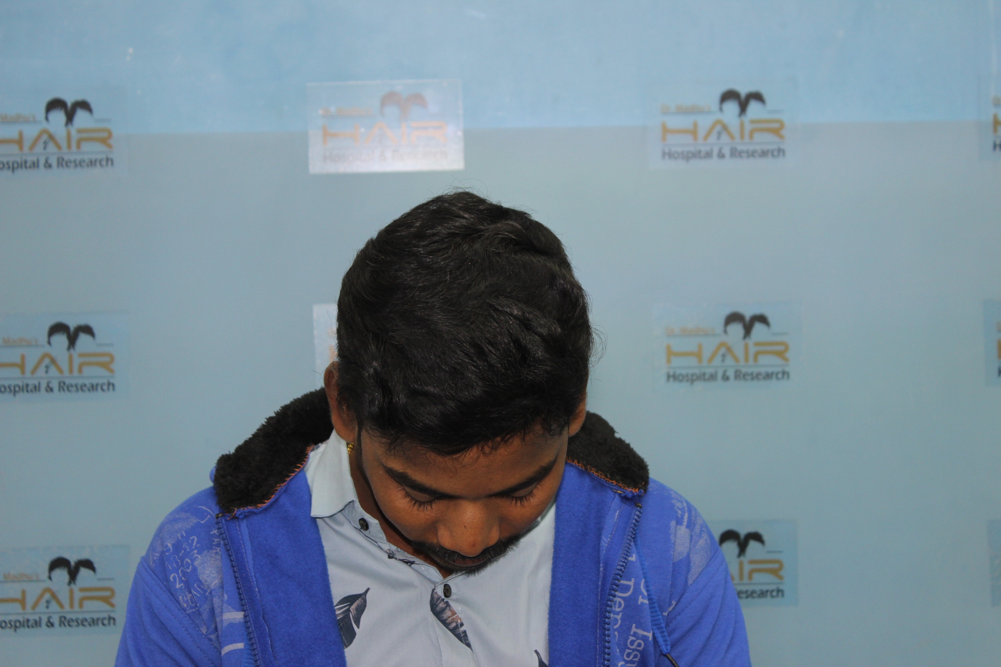 smiling woman wearing brown hat and white tank top