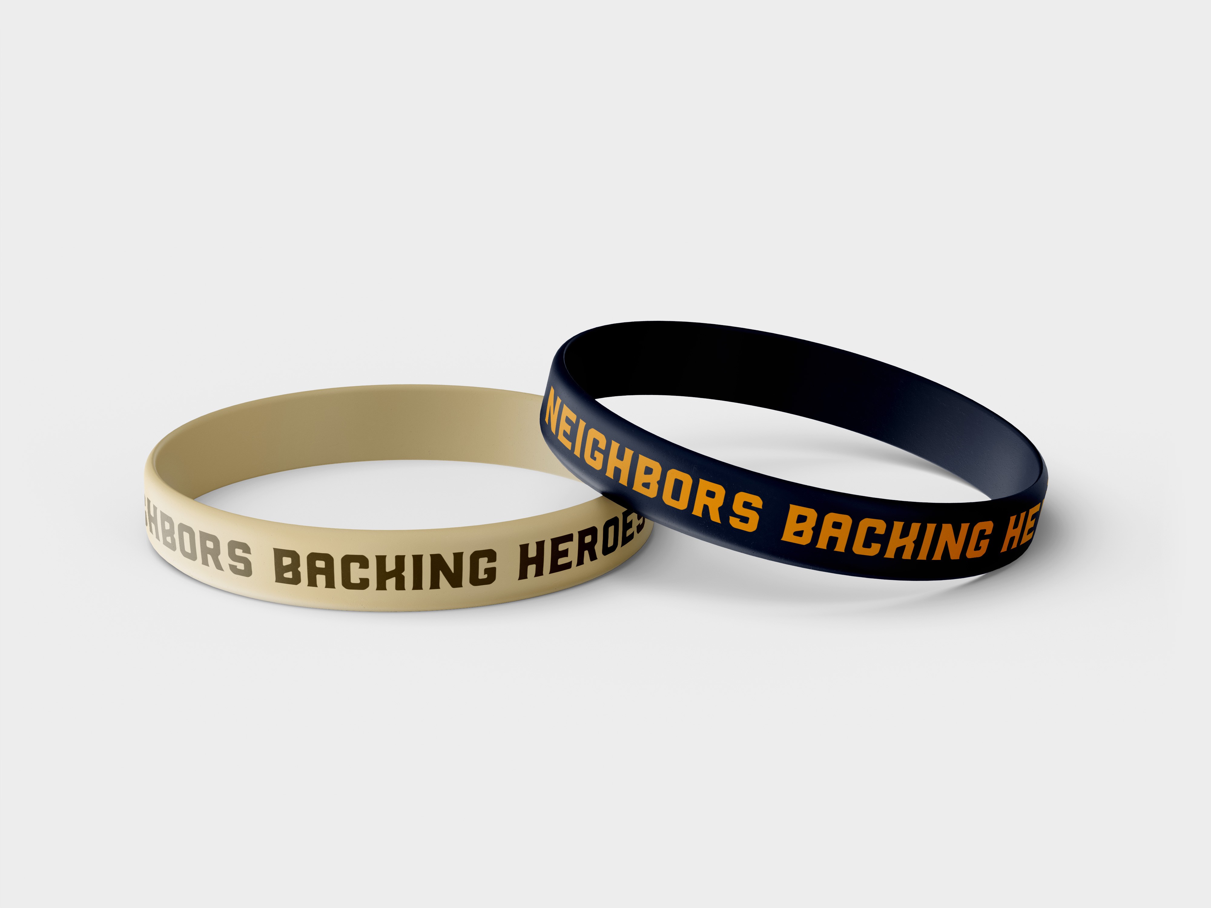 mockup of braclets featuring Hoosier Cowboy Association's tagline, "Neighbors backing heroes"