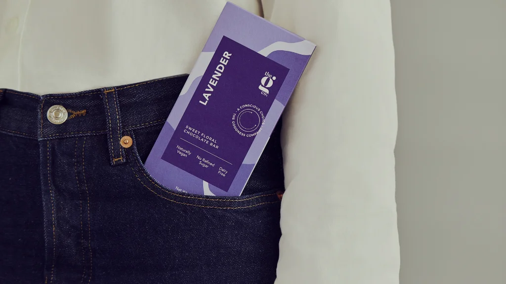 a person wearing jeans and a chocolate bar is tucked in the front pocket