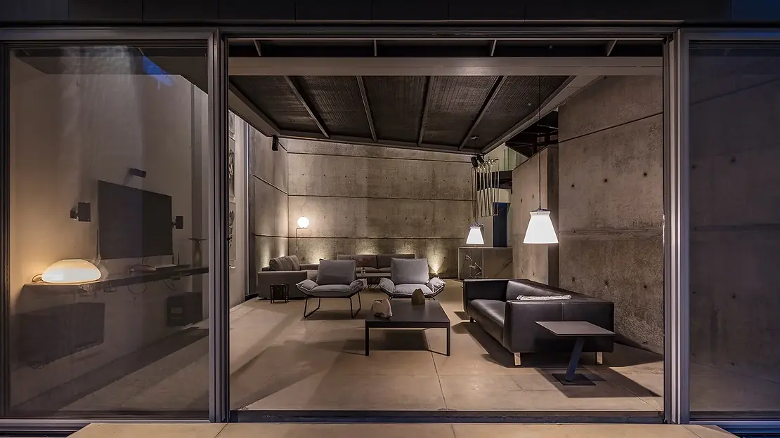 Modern dark living room design at House of Stories, Bangalore by Melange Interiors