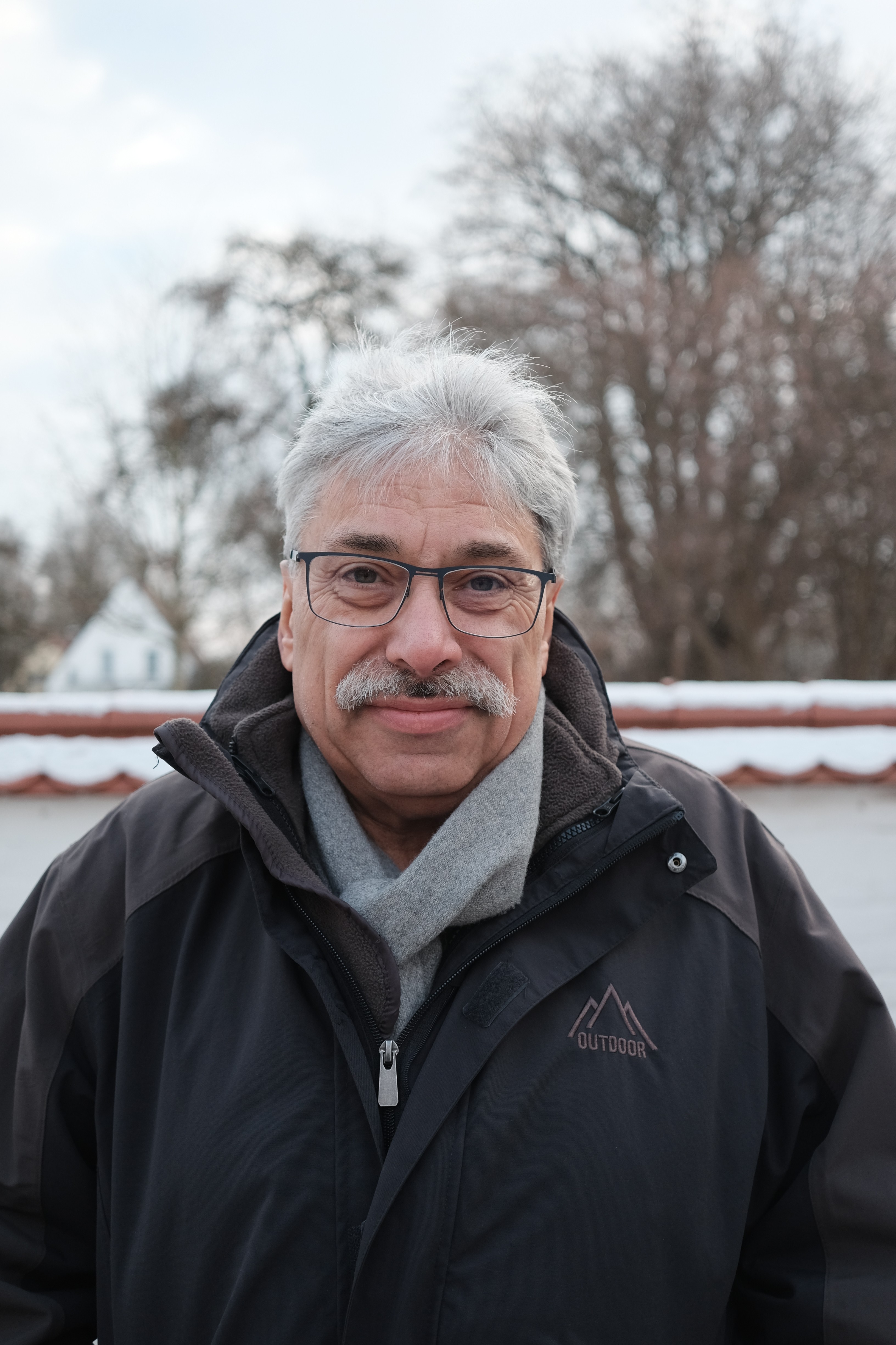 woman in white crew neck shirt smiling