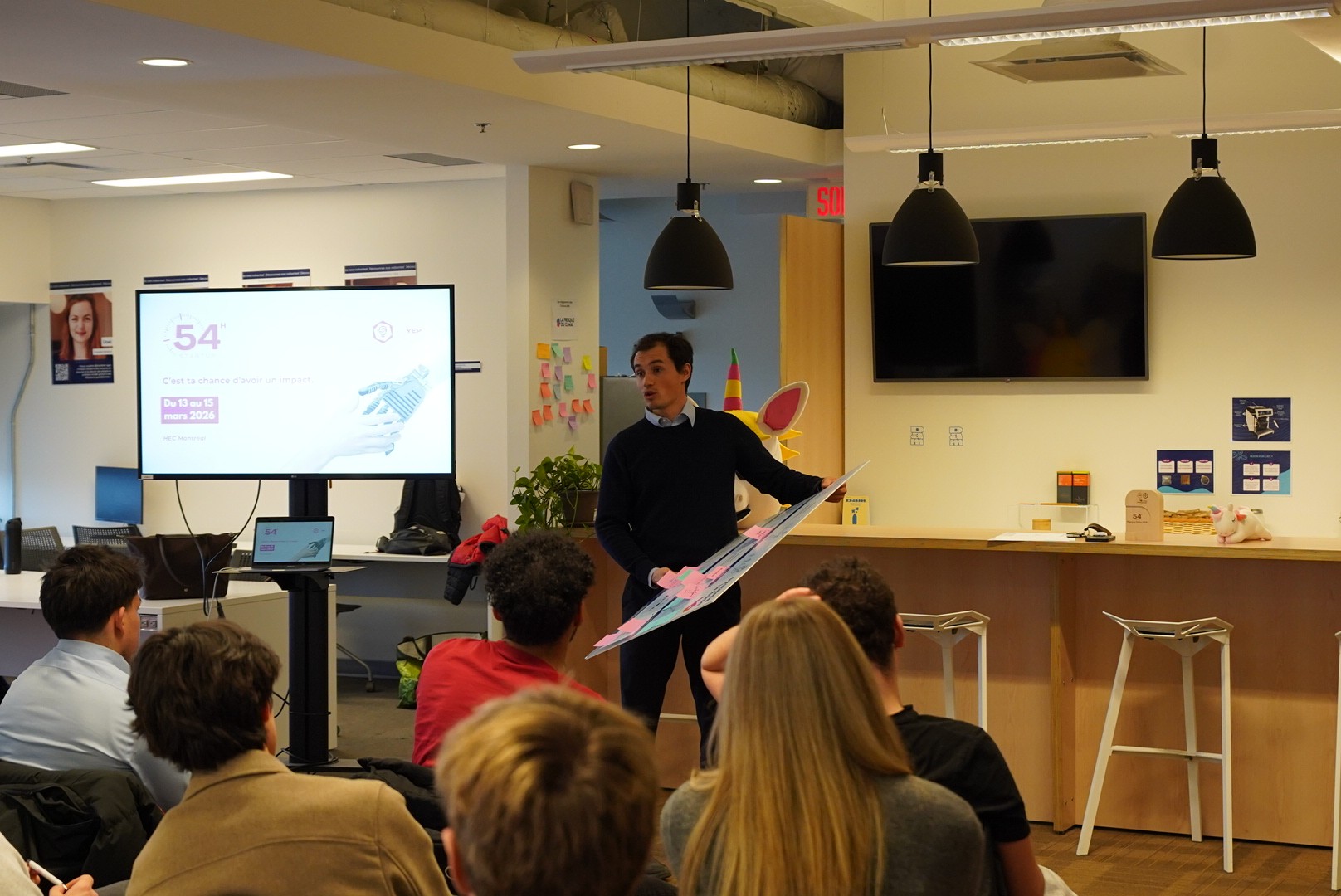 Speaker Presenting at Conference with Audience