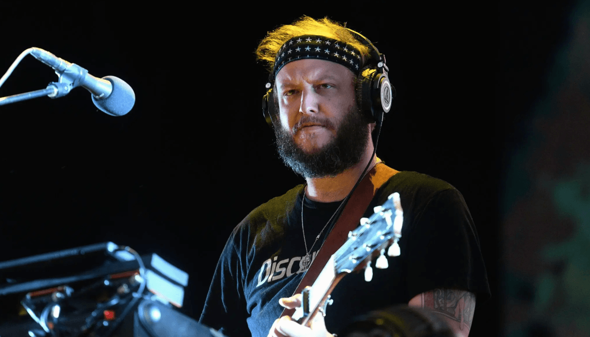 A color photo of Justin Vernon of Bon Iver performing