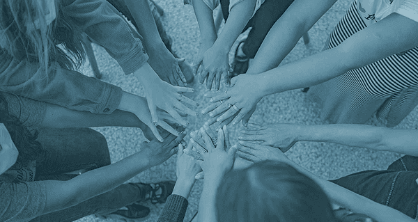 Image of hands interconnected.