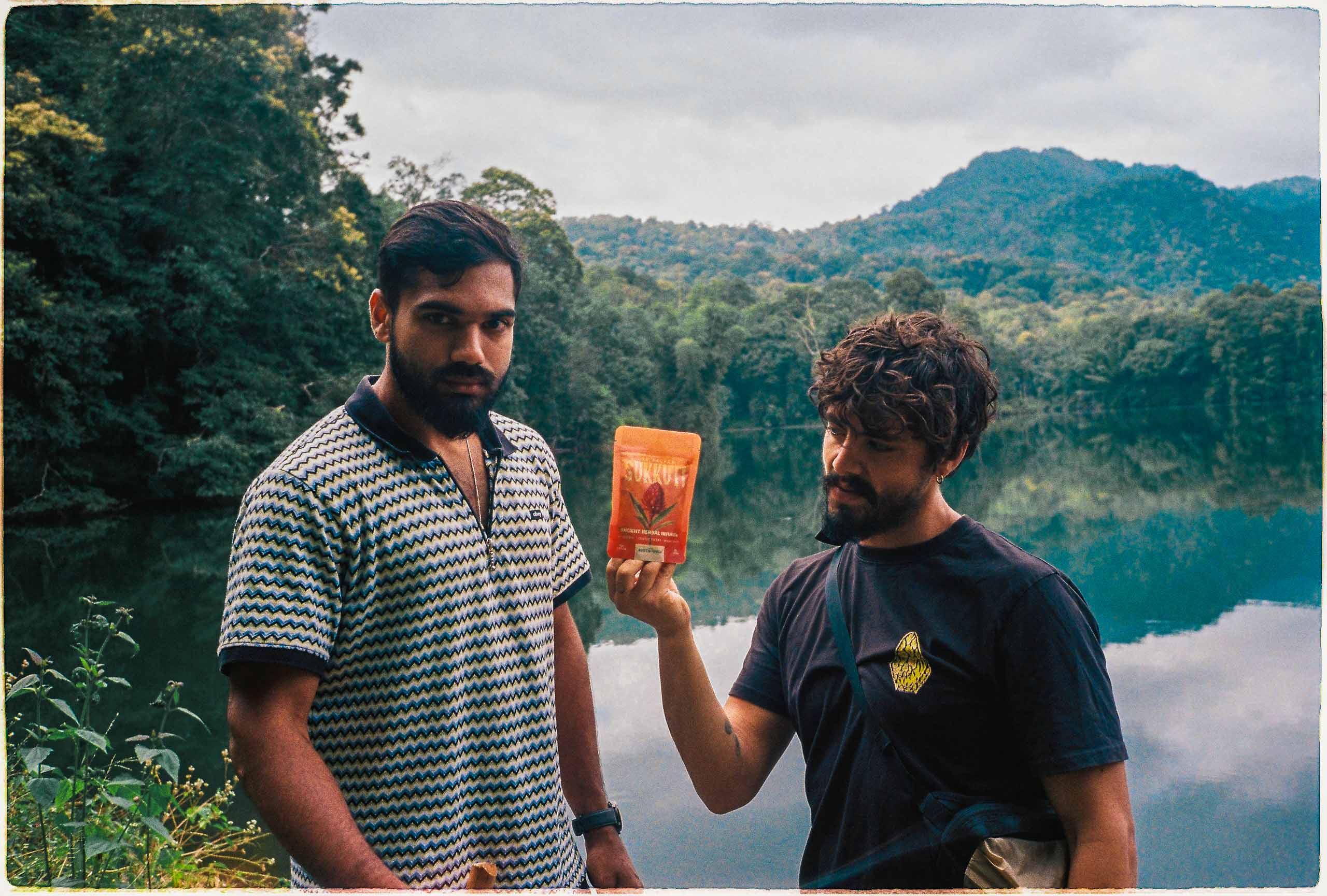 An orange cube-shaped side table is shown.