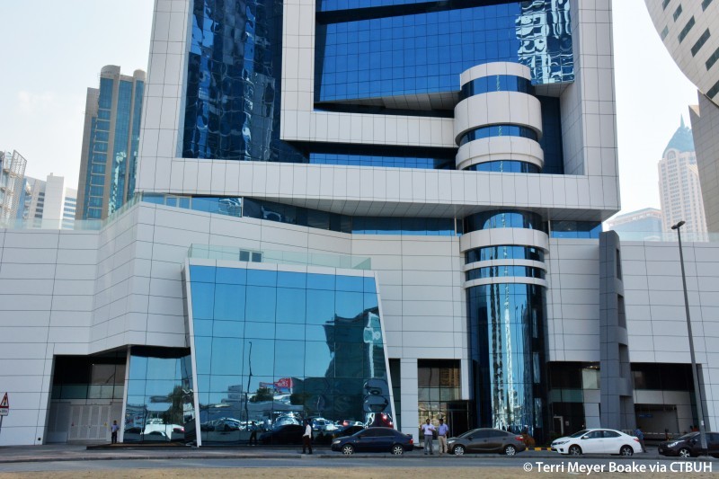 Close-up of the professional entrance and lobby area at The Exchange Tower, Business Bay.