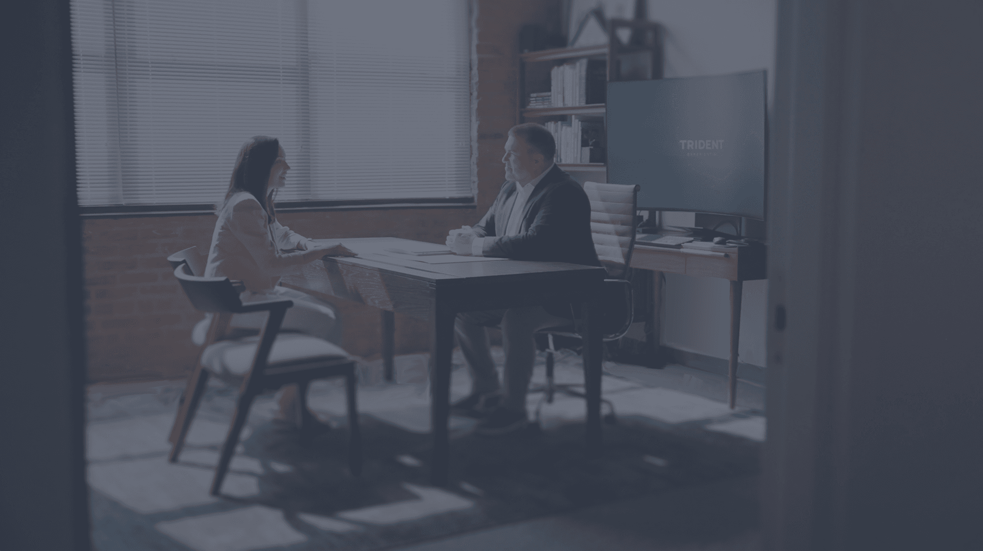 photo of trident staff meeting in office