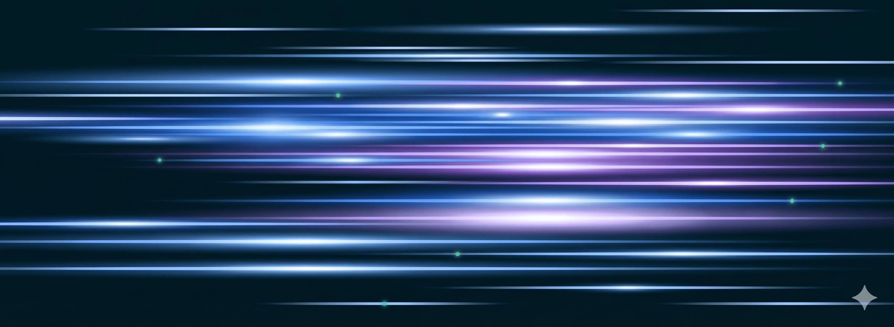 Aerial view of a winding road cutting through rocky terrain with patches of grass.