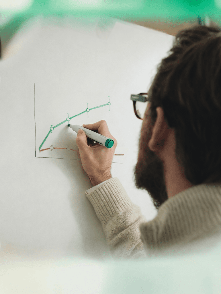 Female scientist wearing a white coat and gloves examines a sample slide in a modern laboratory setting.