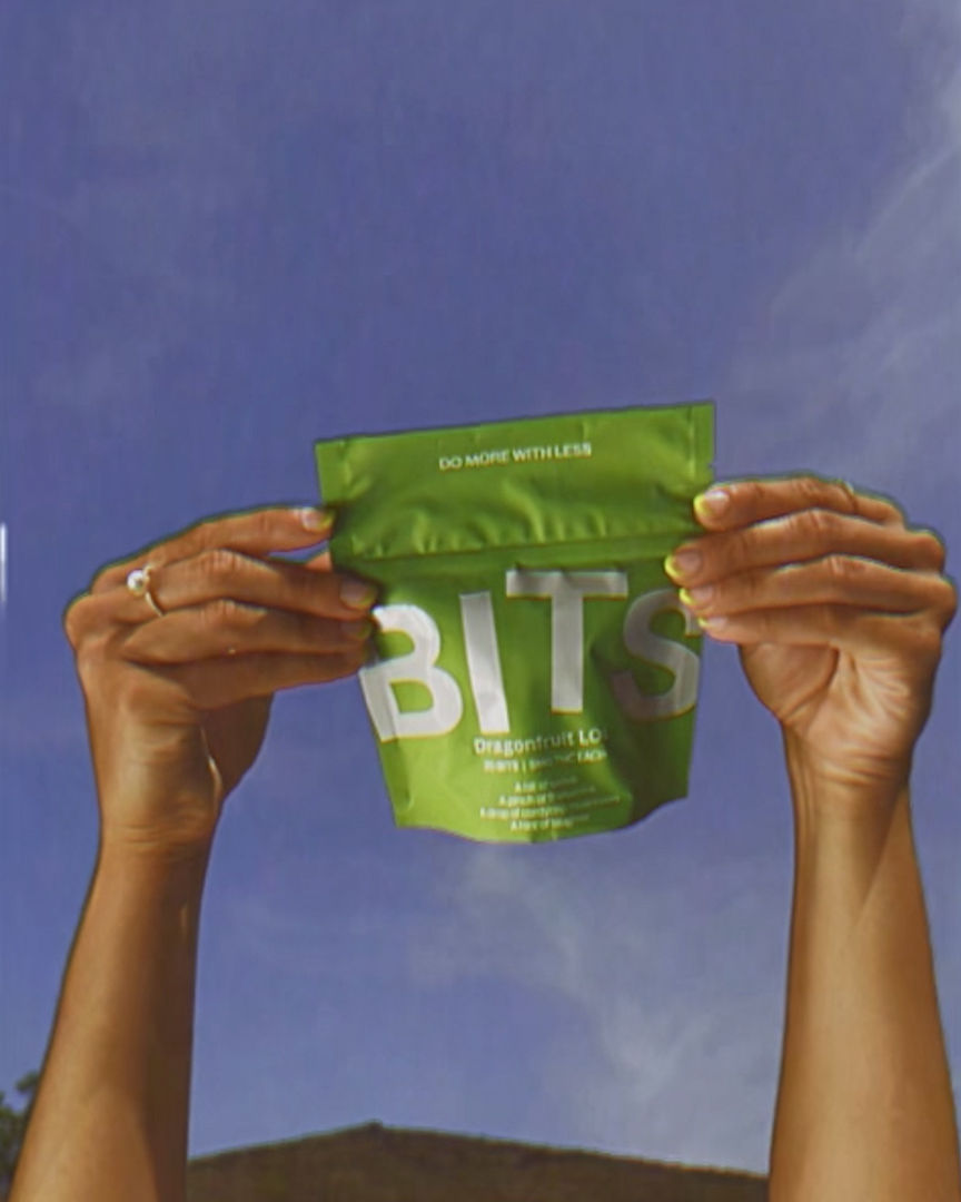 Woman with red hair covering mouth with hair