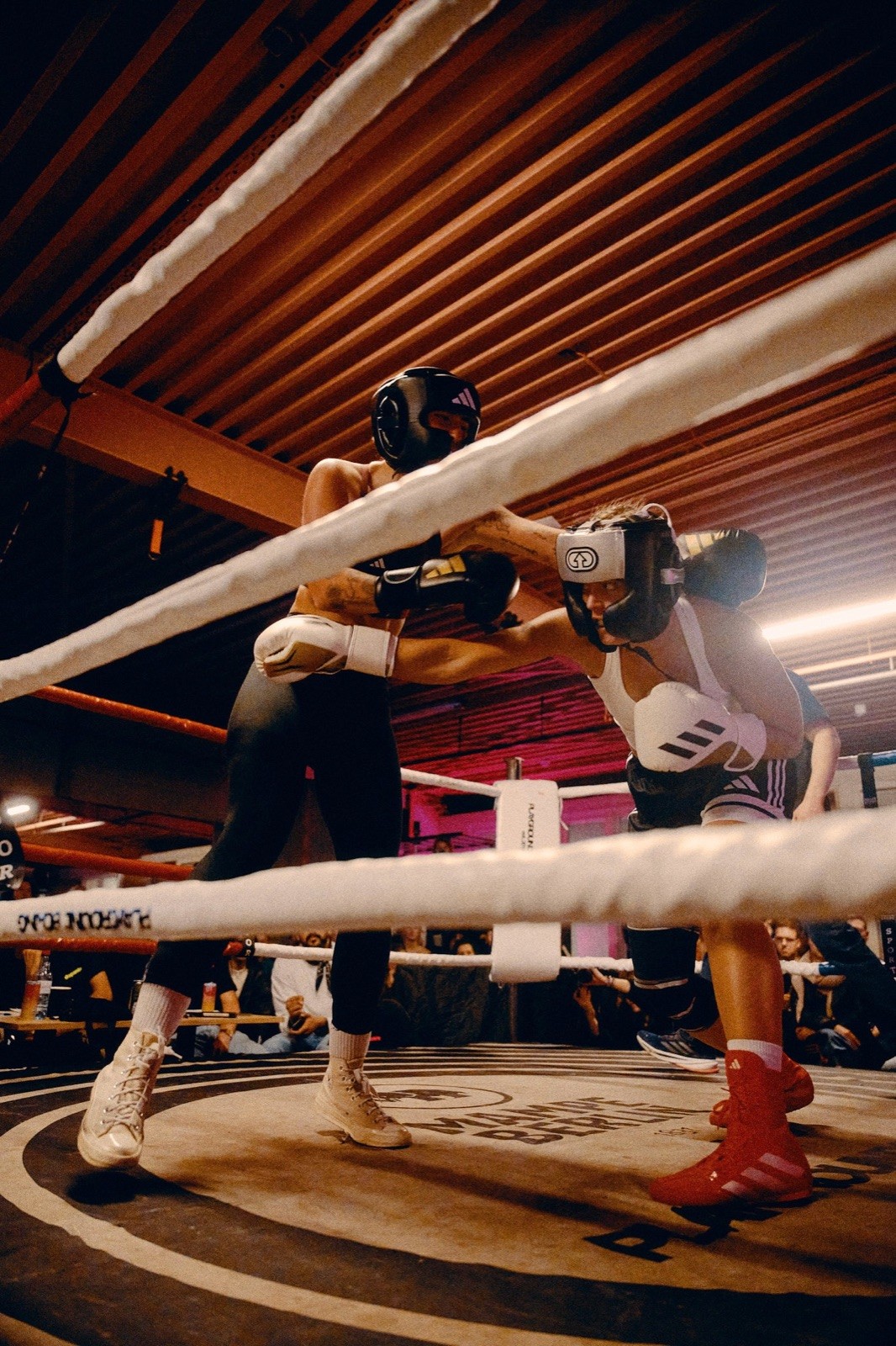 Two members sparring in the boxing ring.