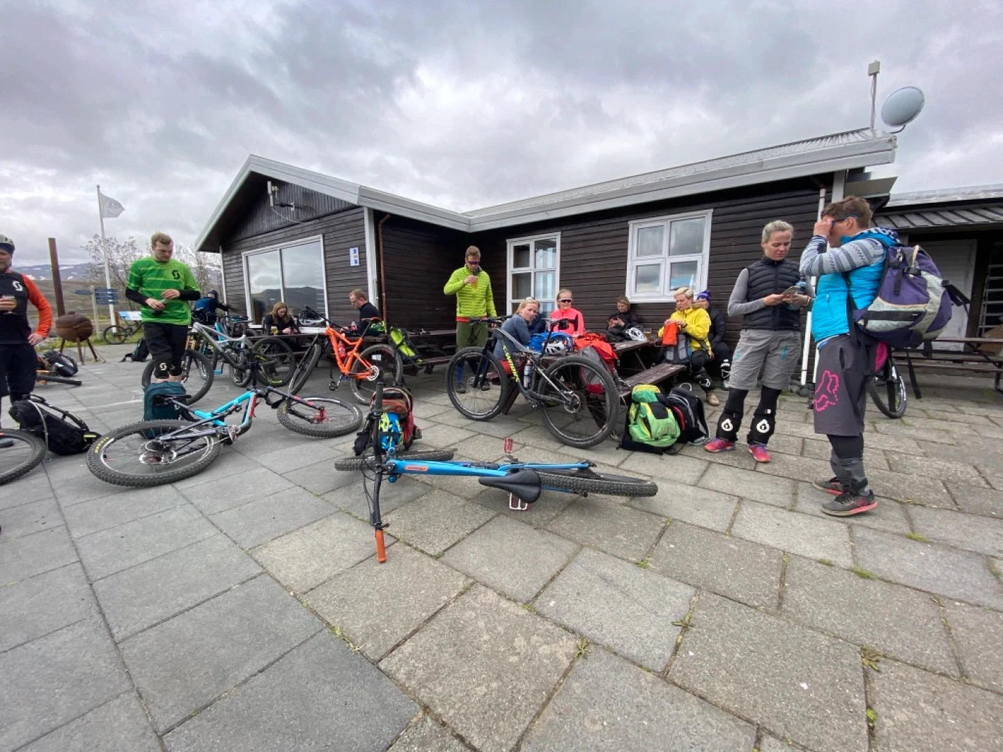 People outside Thorsmork cabin after a bike tour