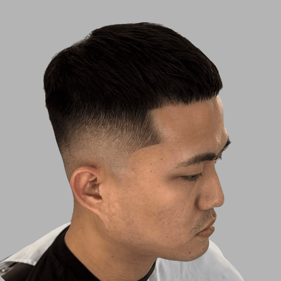 person holding white and gold hair comb