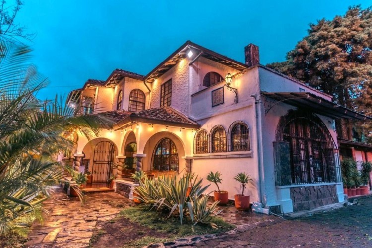 sunloungers fronting buildings near mountain