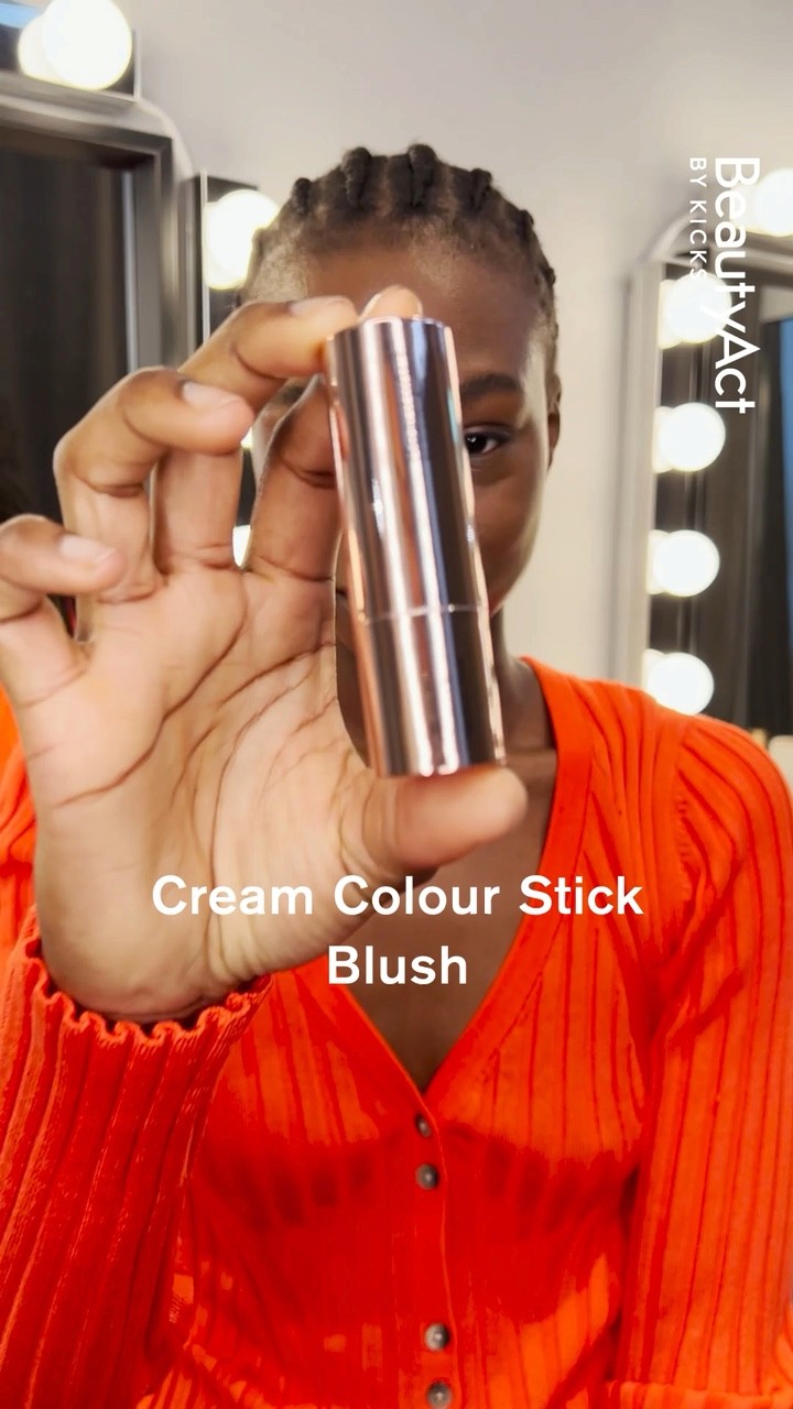 BeautyAct film still showing a model holding a cream blush product