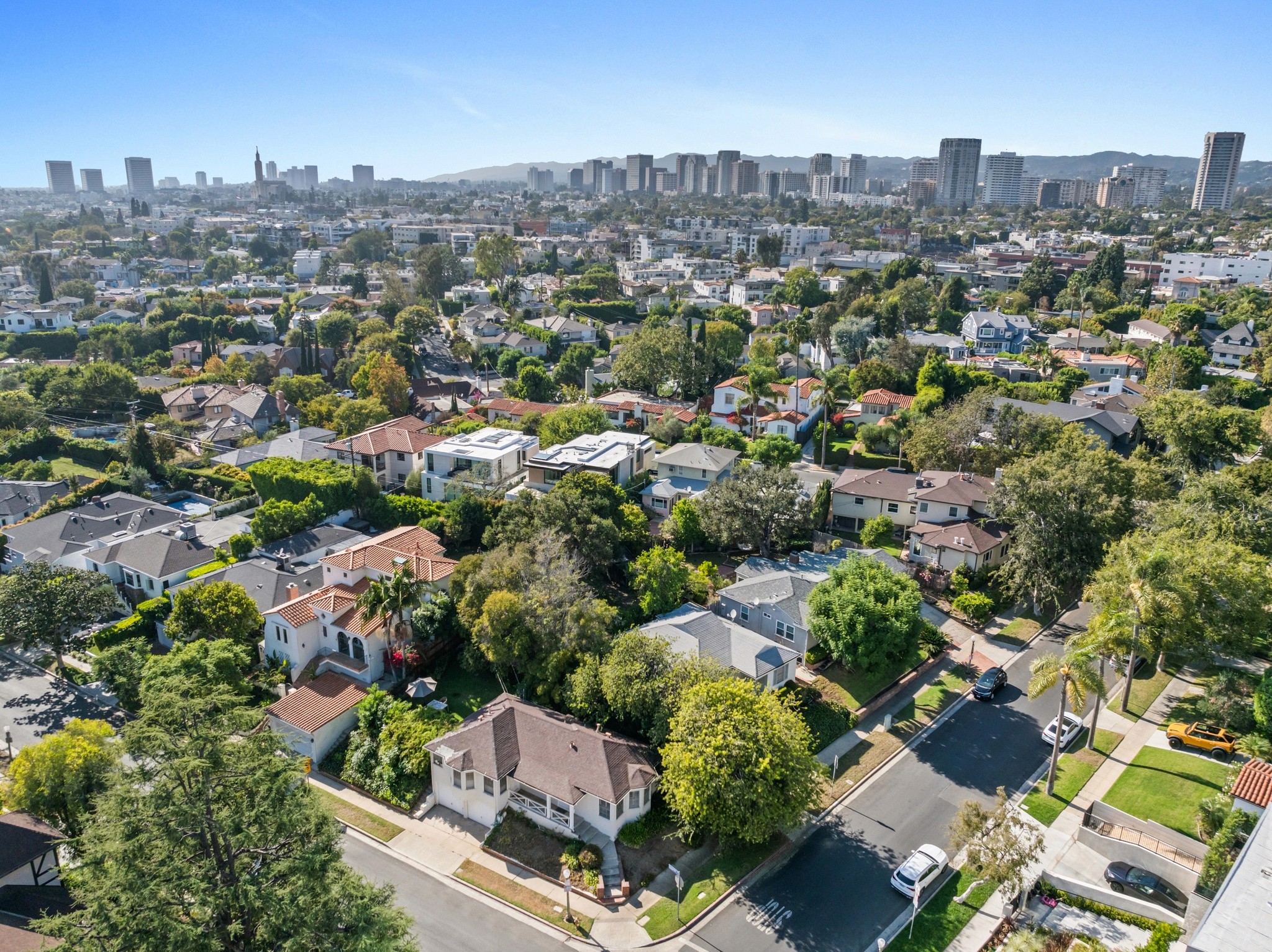 Aerial view of a suburban area  by 10301 mississippi, with houses surrounded by greenery.