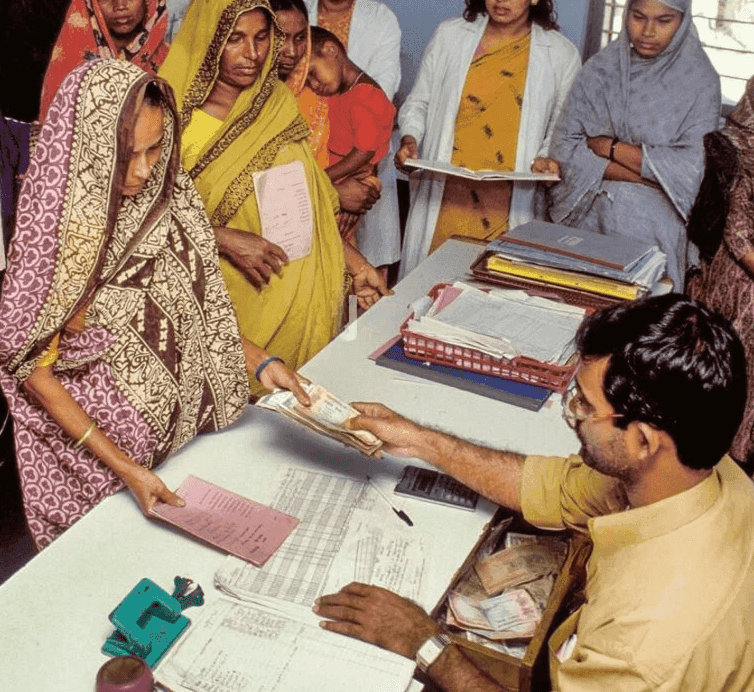 Person helping another with finances
