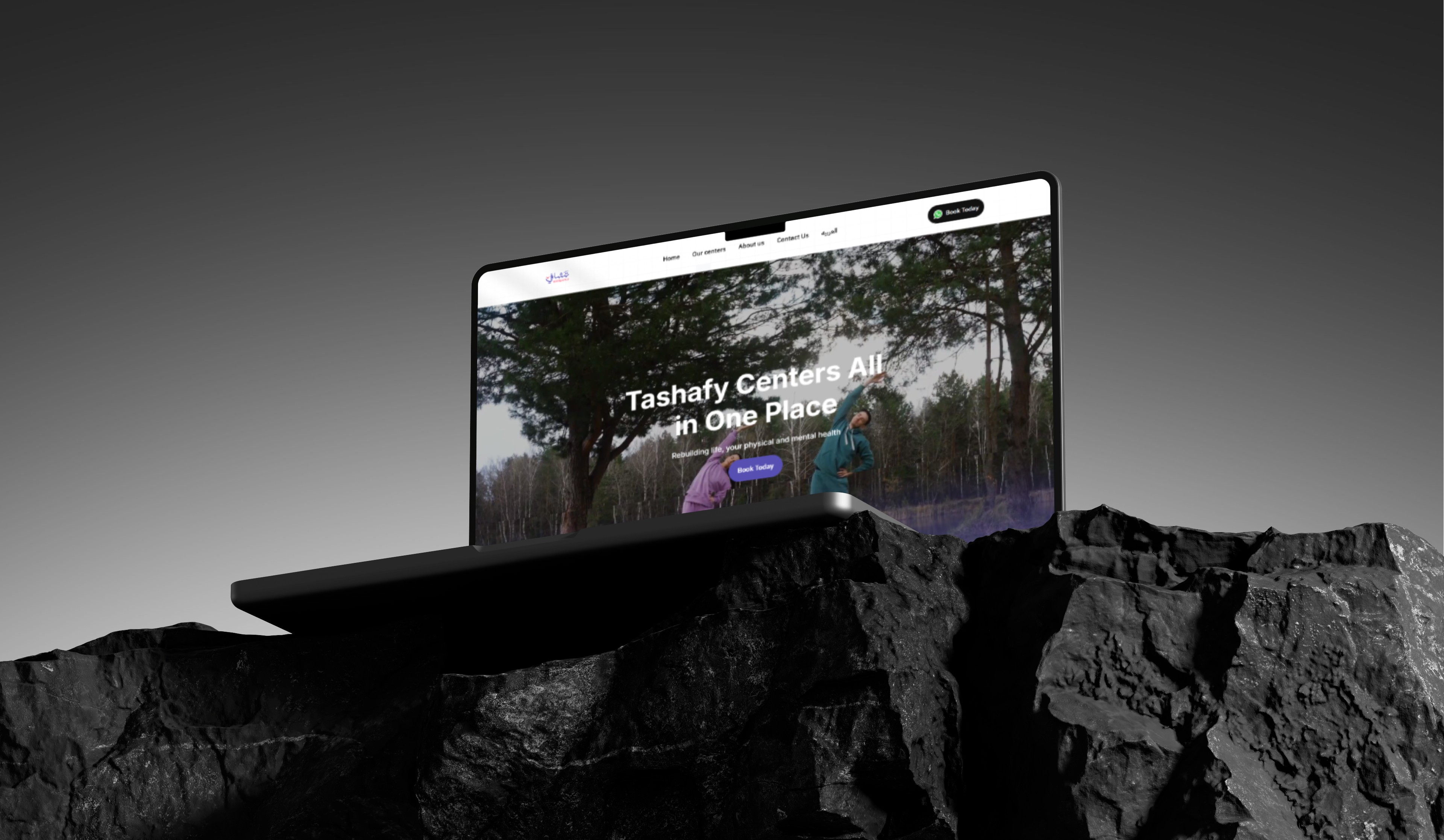 Laptop displaying website on rocky surface. Website shows people enjoying nature and text "Tashay Cottons: A Cabin Dew Place".