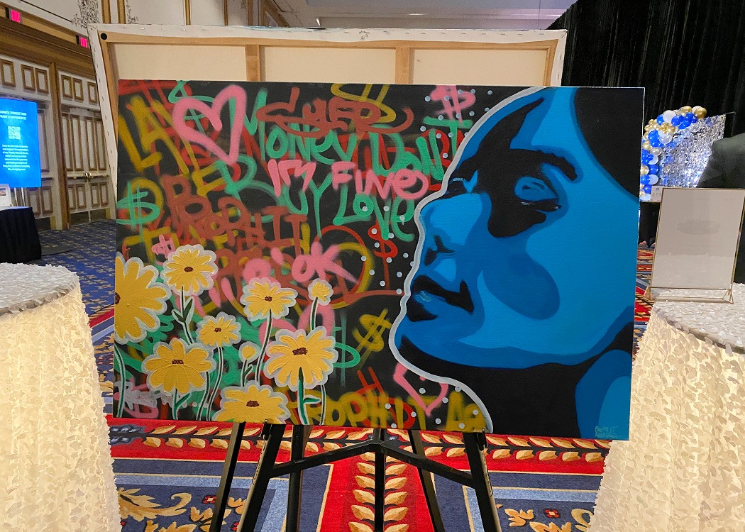 painting of face and graffiti lettering