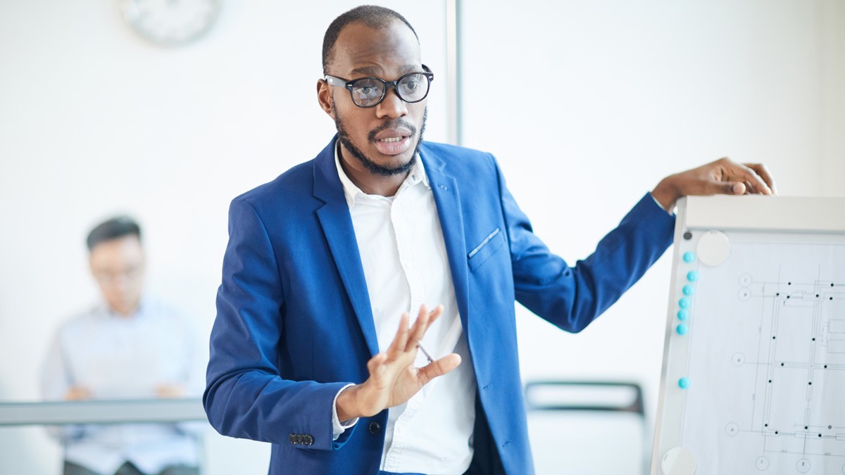 Business coach during a coaching session in a board room