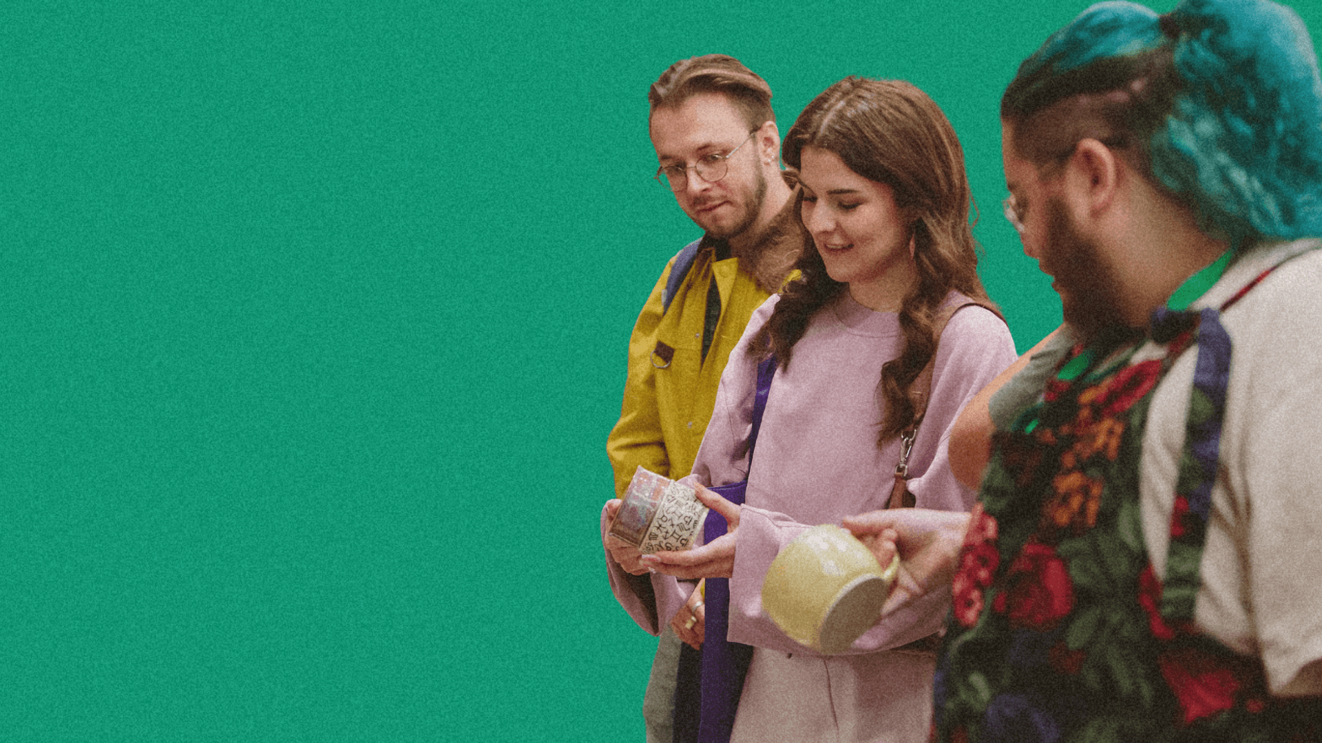 Three people standing in front of a bright green background, each holding items, with varying hairstyles and outfits.