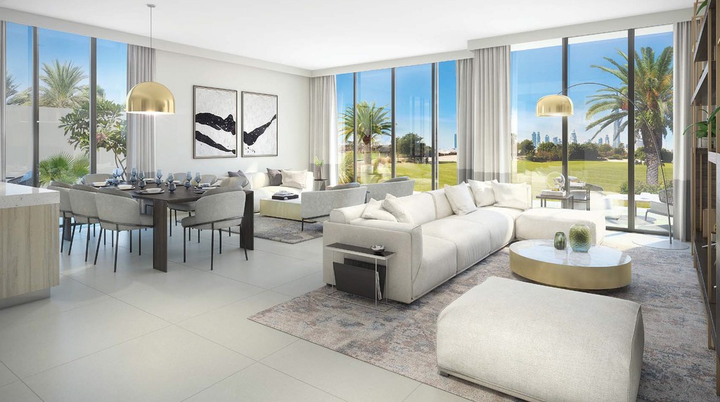 A modern living room in Club Villas features large windows showcasing a stunning view of the sea.