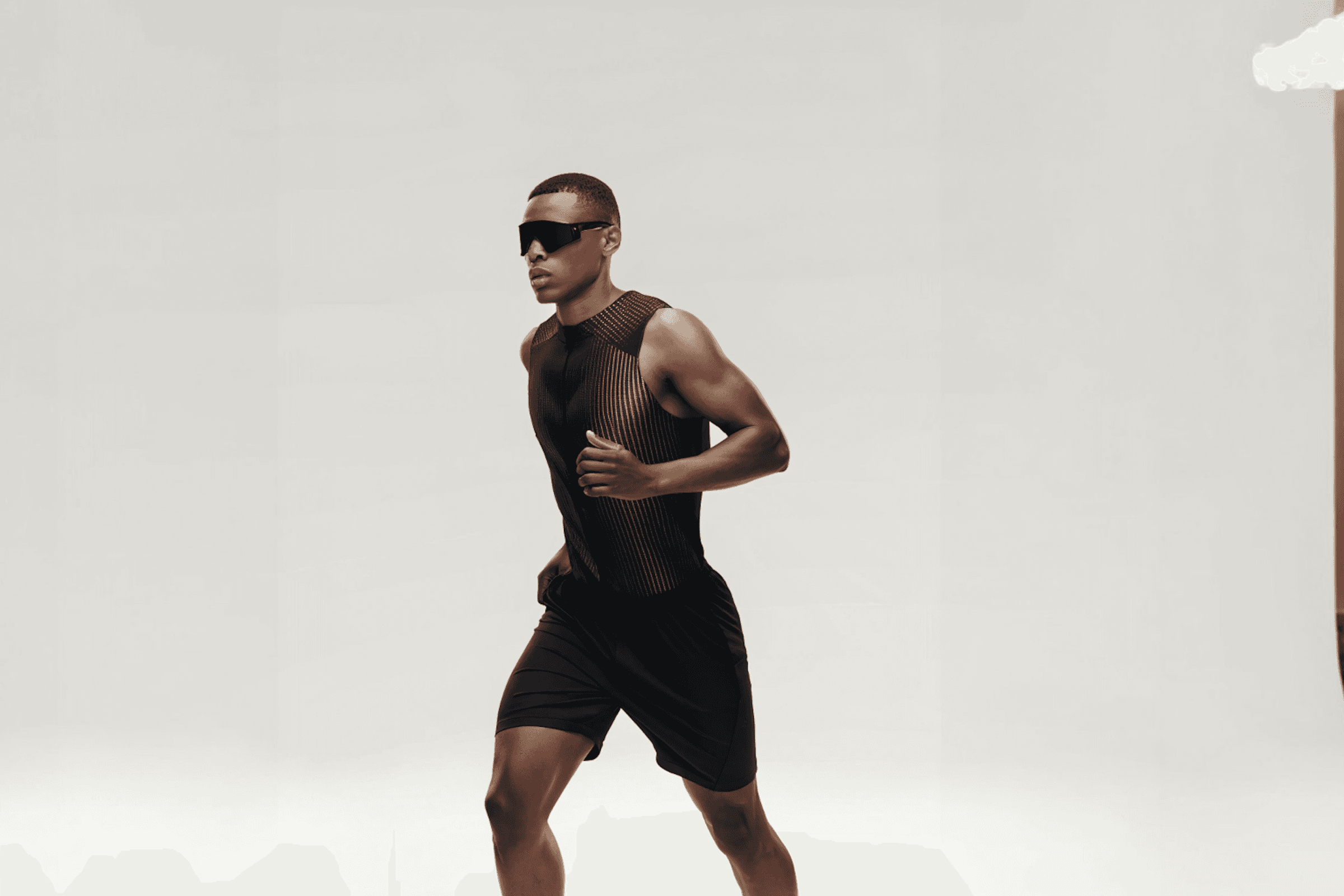 Athlete walking post-run in minimalist fitness photography for supplement brand
