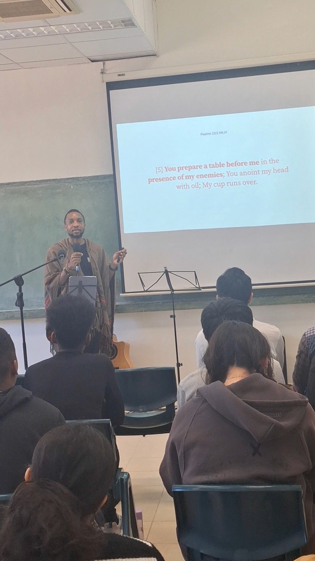 Vimbai sharing his story at a youth camp