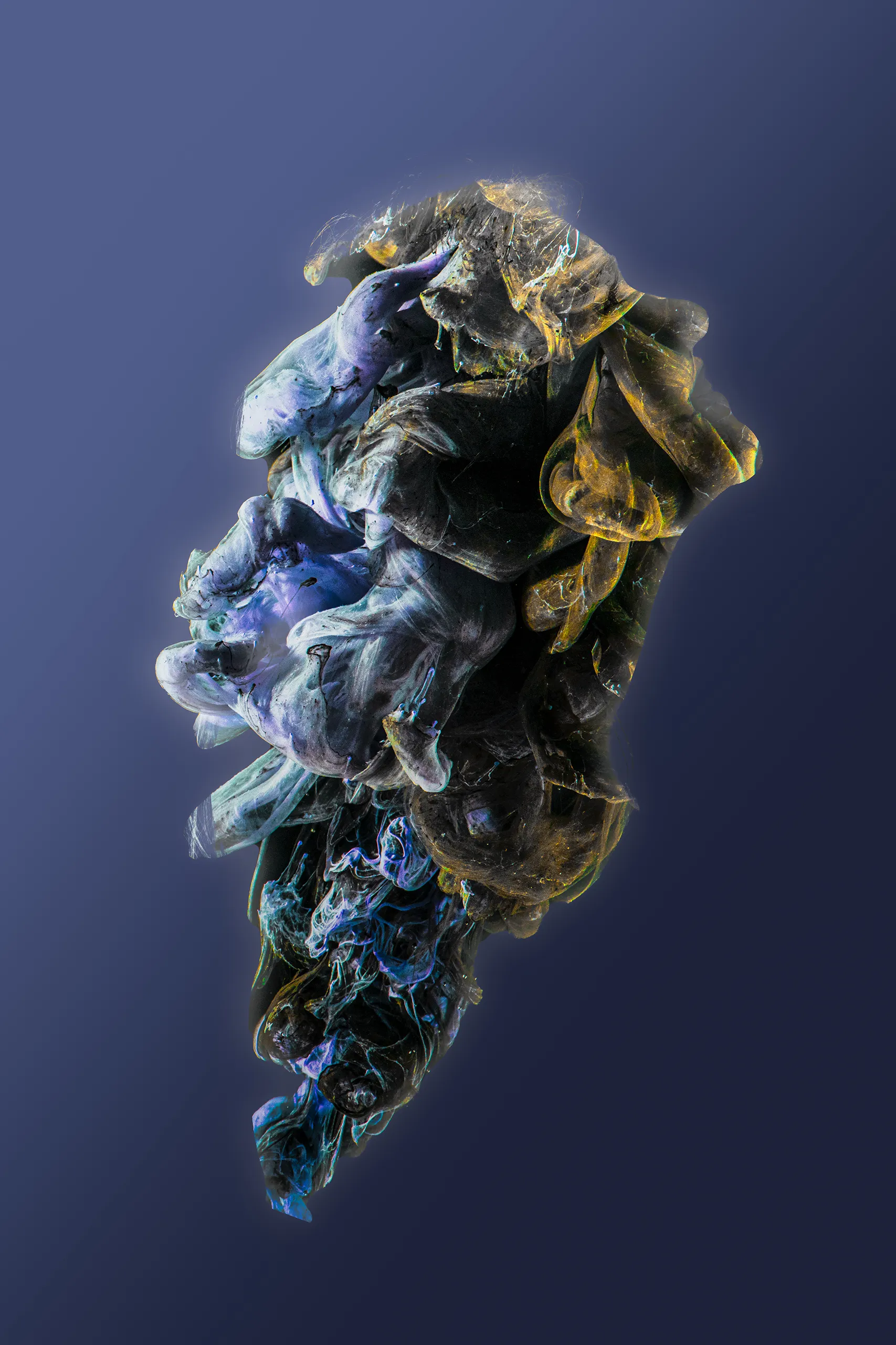 A dramatic, high contrast abstract image of dark blue and black ink with integrated metallic gold pigment forming a cloud against a deep blue background.